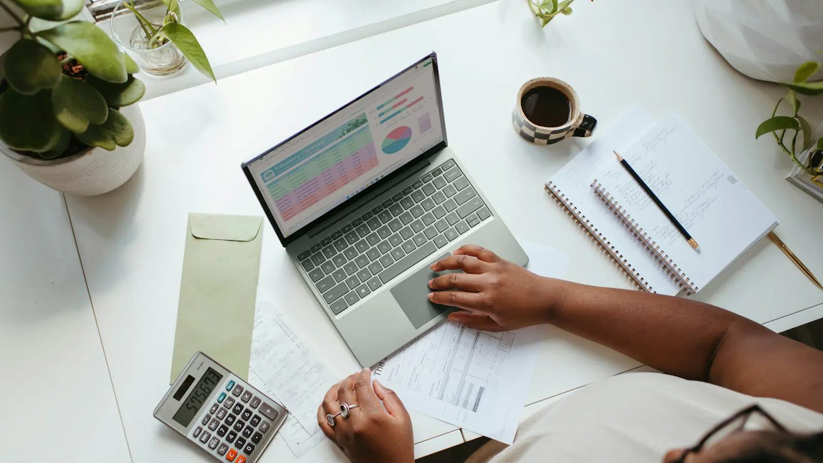 lead generation cost Perth — a person sitting at a table with a laptop