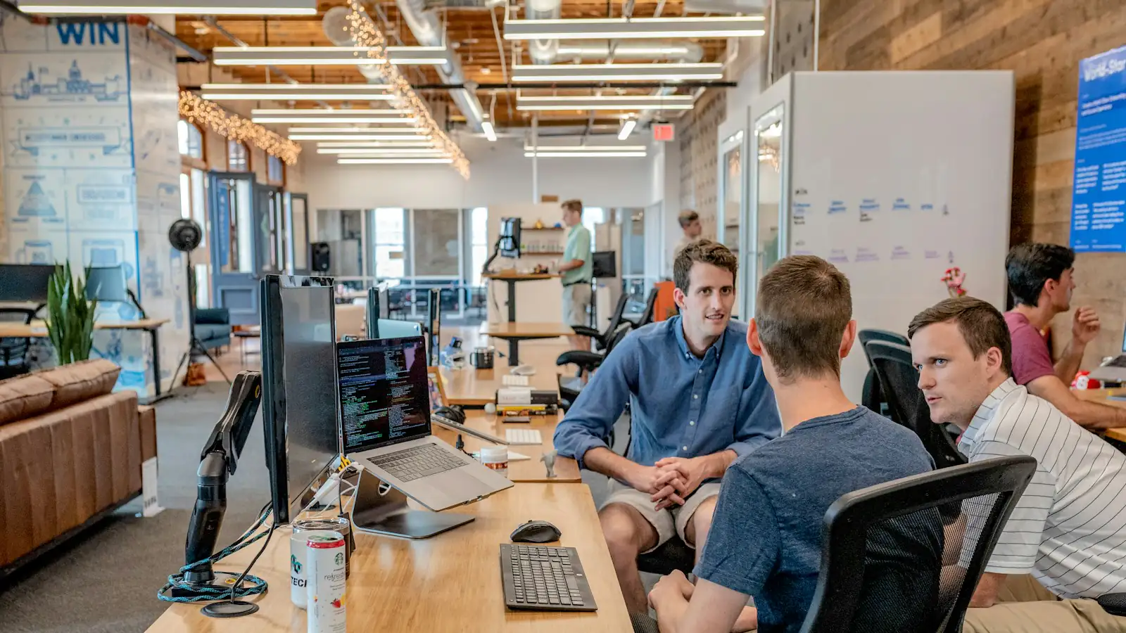 lead generation service business — three men sitting on chair beside tables