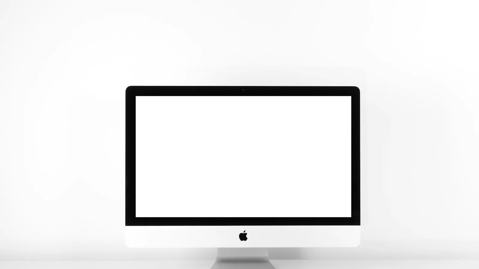 new website Perth business — silver iMac with Apple Magic Keyboard on white sufrace