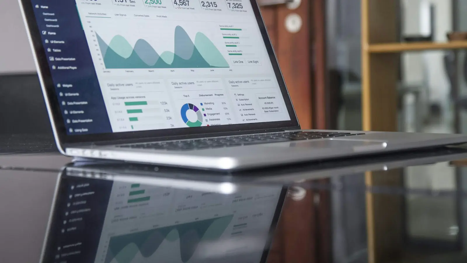 SEO cost Perth — laptop computer on glass-top table