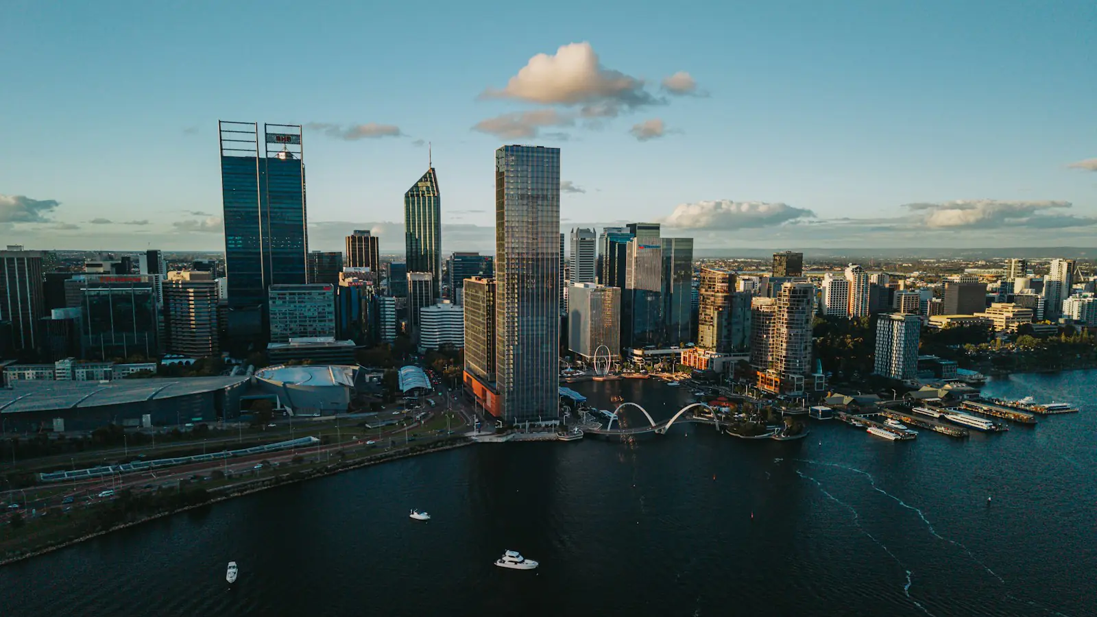 SEO Perth — Modern cityscape with skyscrapers and a river at sunset